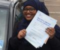 Hoda with Driving test pass certificate